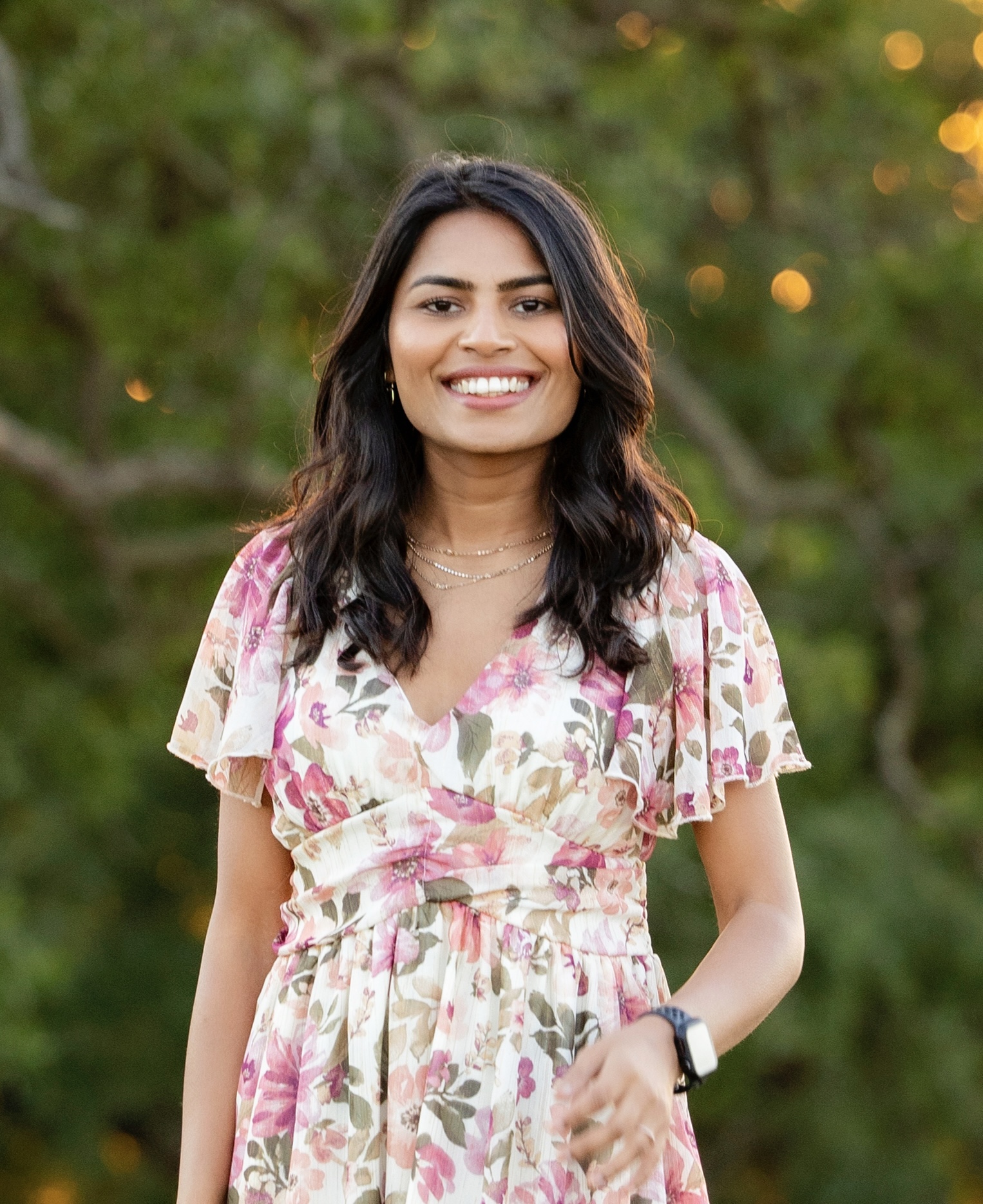 Priyanka Gupta smiling while seated with a notebook